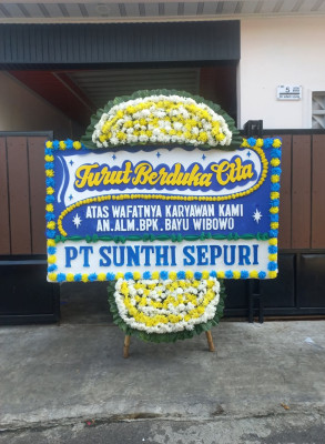 Papan Bunga Duka di Jalan Baru